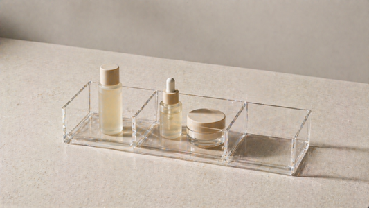 skincare items grouped in an organizer with one single item, two items together, and an empty compartment for clear routine flow