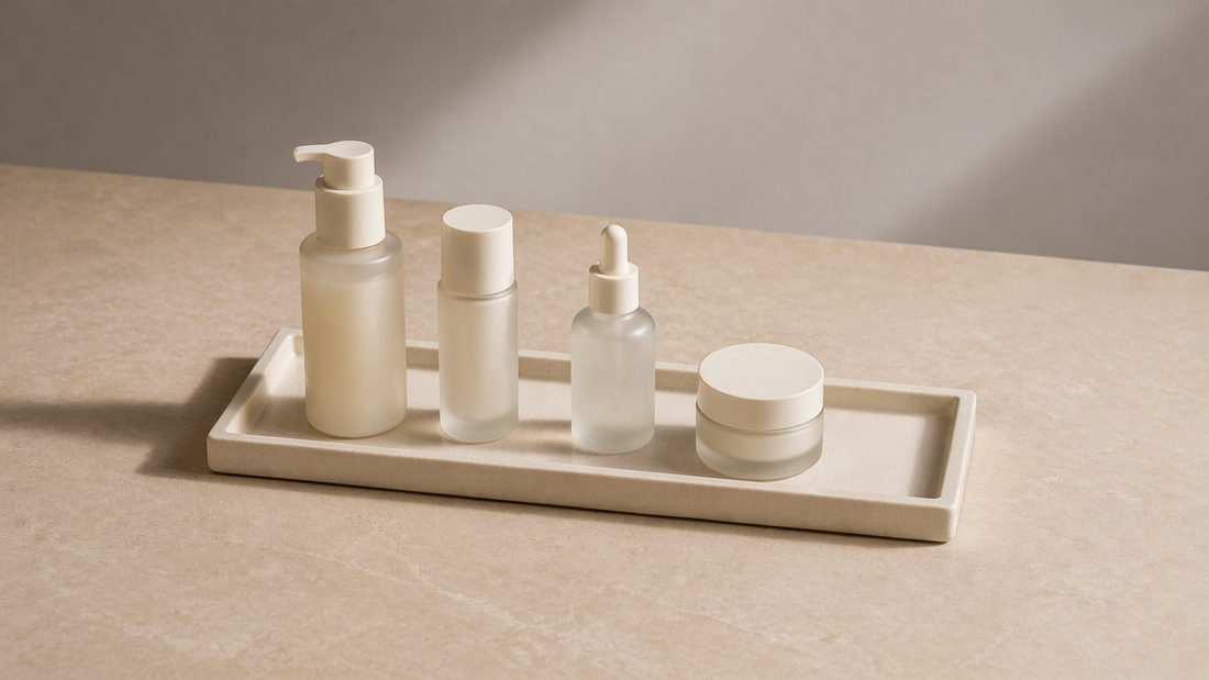 Skincare arranged in sequence on a tray.