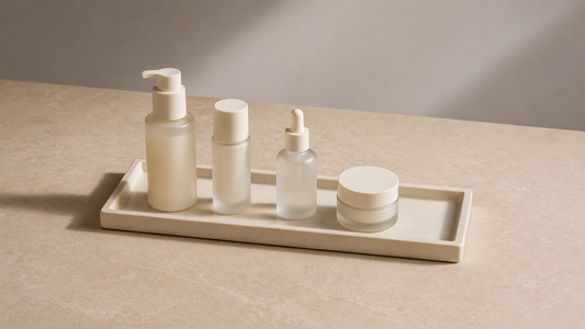 Skincare arranged in sequence on a tray.