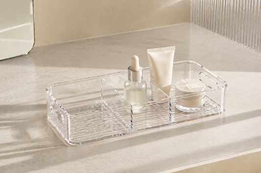 Minimal skincare organizer with separated items and clear spacing creating a stable routine setup.