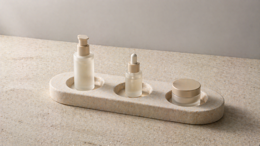 Skincare items placed in fixed recessed slots on a surface organizer for consistent daily placement.
