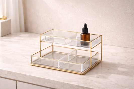 Three skincare bottles spaced apart in a single-layer organizer positioned centrally on a vanity to reduce exposure to heat and light