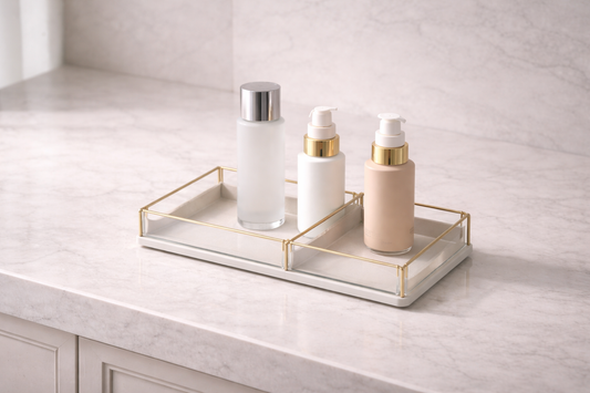 Skincare items separated into two usage zones within a single tray through spacing and layout