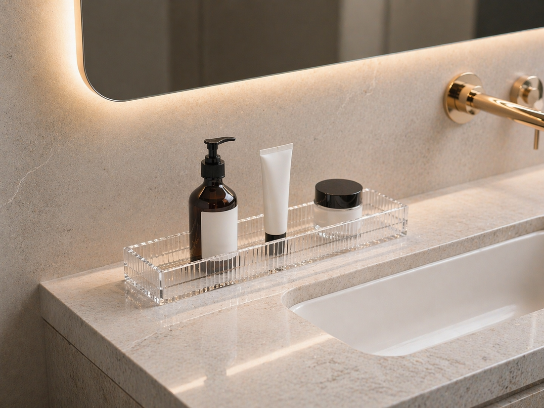 acrylic tray organizer with 3 minimal items spaced clearly on a small vanity for easy access and visibility