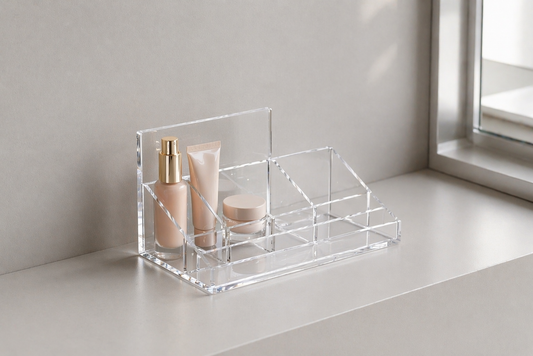 Slim acrylic makeup organizer arranged on a narrow vanity surface with clear spacing between items for efficient use.