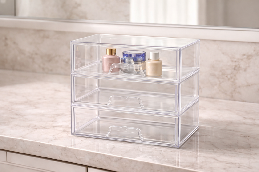Transparent stackable drawer organizer with a few beauty items in the top drawer.