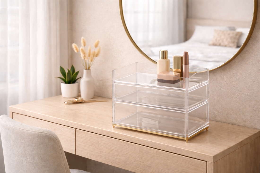 A compact makeup station in a small apartment with a clear multi-level organizer.