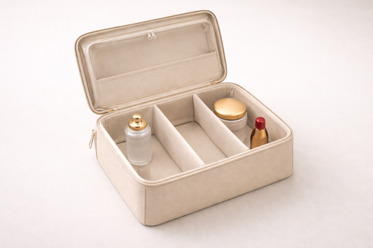 Beige travel case with 3 items clearly segmented and one empty section, showing fast packing efficiency and clean organization flow.