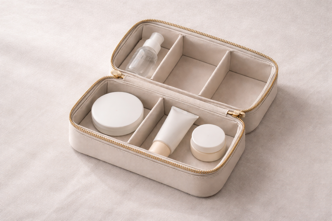Compact travel beauty storage with selected essential items placed in separate compartments and one empty space, showing a prioritized layout for faster packing.