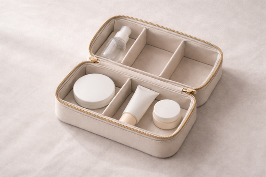 Compact travel beauty storage with selected essential items placed in separate compartments and one empty space, showing a prioritized layout for faster packing.