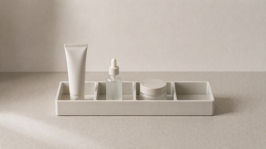 Vanity organizer with fixed slots maintaining consistent item placement over time.
