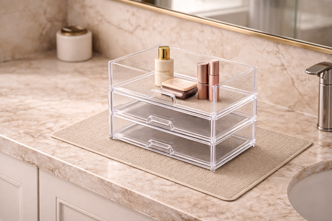 Protective mat placed under a clear acrylic bathroom organizer on a vanity counter.