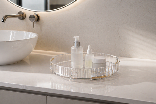 rotating vanity organizer with 3 items spaced along the tray for easy access on a limited bathroom counter