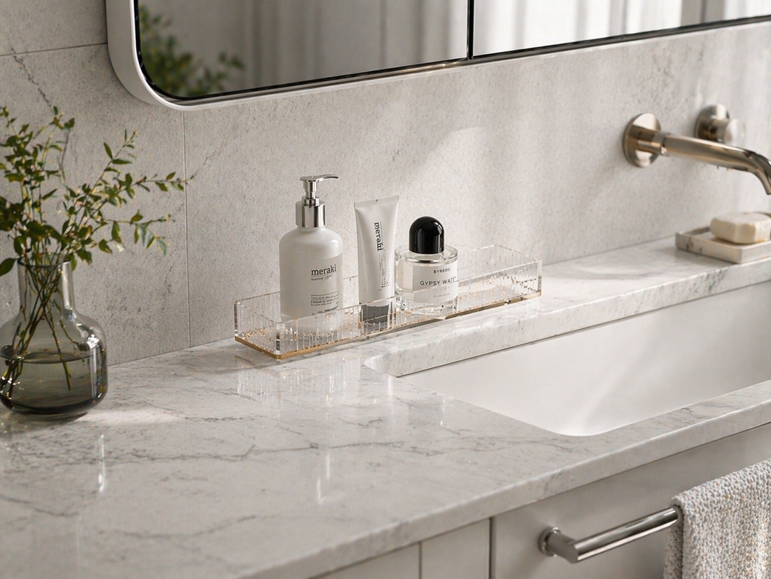 narrow vanity counter with slim linear acrylic organizer holding 3 vertically oriented items aligned front-to-back with clear spacing for structured narrow storage  평가: 9.2/10