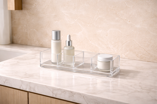 Clear acrylic bathroom vanity storage organizer showing separated compartments that create distinct functional zones and prevent task overlap.