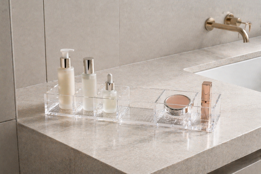 Vanity surface clearly divided into skincare and makeup zones with a visible empty divider for structured routine flow.