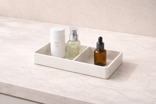 Single vanity organizer divided into two sections with skincare items arranged separately for morning and night routines
