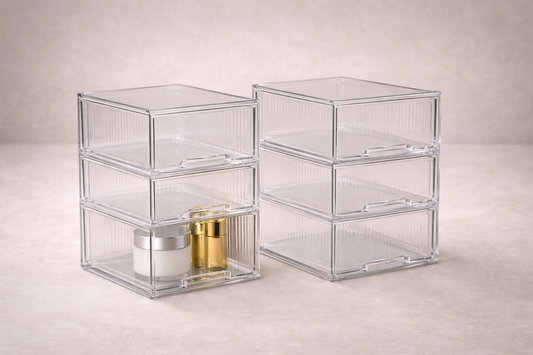 Transparent multi-layer drawers with minimal items and clear spacing for fast identification.